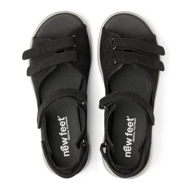 Women´s sandal with adjustable velcro straps and half-open heel cap