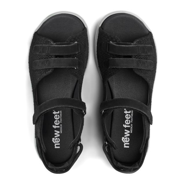 Women´s sandal with adjustable velcro straps and half-open heel cap