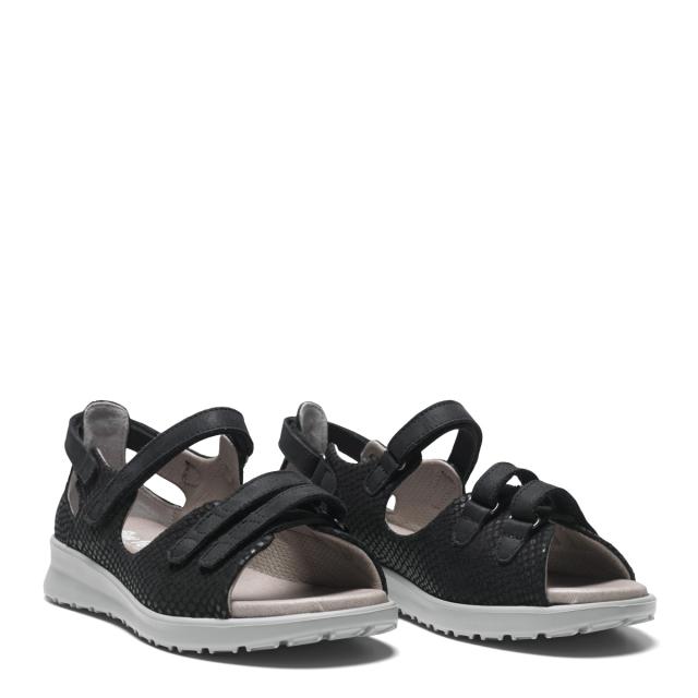 Women´s sandal with adjustable velcro straps and half-open heel cap