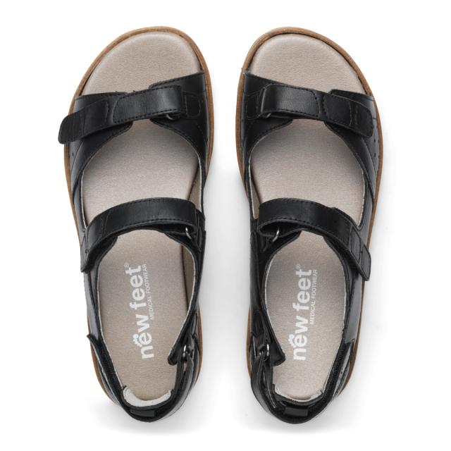 Women´s sandal with two adjustable velcro straps and half-open heel cap